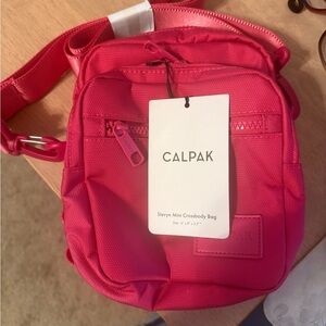 Calpak Vibrant Pink Crossbody Bag